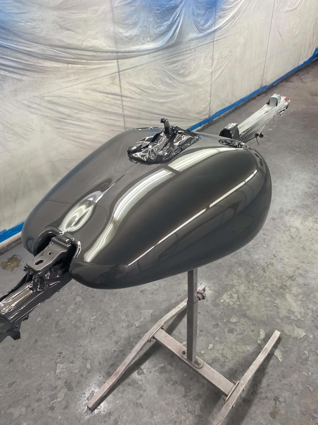 Freshly painted tank on a stand